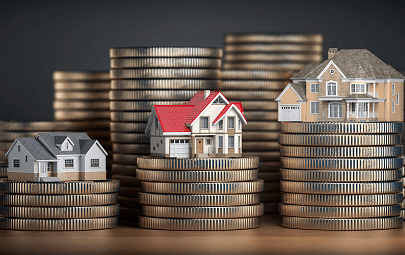 Stacks of coins getting progressively larger with small models of houses on top of each stack