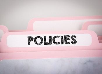 File folder with policies written on it
