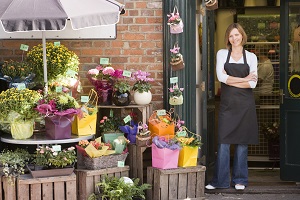 woman standing outside flower business