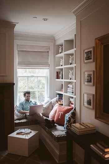 man working on laptop at home